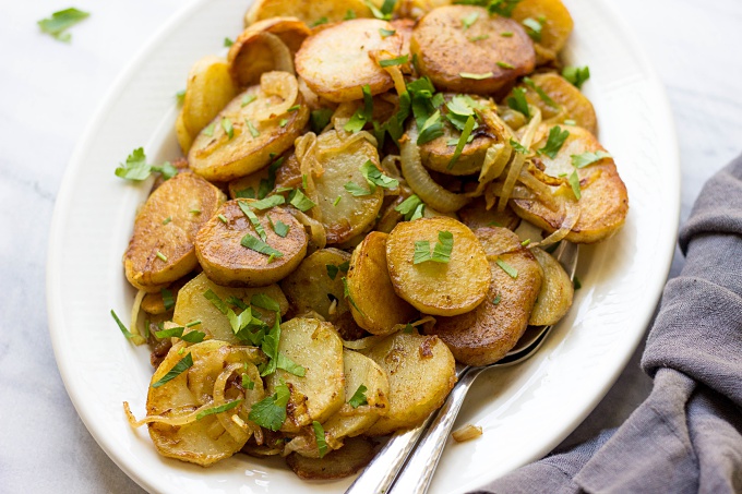 Need a versatile side dish perfect for a weeknight meal? These French Pan Fried Potatoes and Onions are the answer. Pair this 5-ingredient side dish with chicken, steak, pork, or fish!