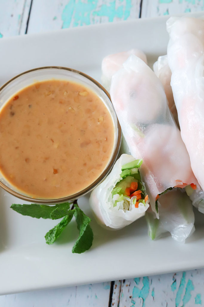 Perfect for picnics, as a party appetizer, or a healthy quick meal, these Shrimp Rice Paper Rolls are ready in 15 minutes. Fresh veggies and flavorful shrimp are wrapped up in rolls and served with Peanut Sauce for dipping.