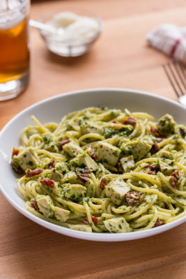 You won't believe how easy it is to turn leftover chicken into this 5-Ingredient Chicken Pesto Pasta made with simple pantry staples that is ready in about 15 minutes! A cheap healthy meal perfect for a busy weeknight dinner.