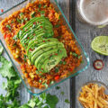 This simple 30-Minute Vegetable Enchilada Risotto is a one-pan recipe perfect for a weeknight meal. This cheap healthy dinner combines zucchini, peppers, onions, cheese, and risotto with enchilada sauce and a secret ingredient that might surprise you!