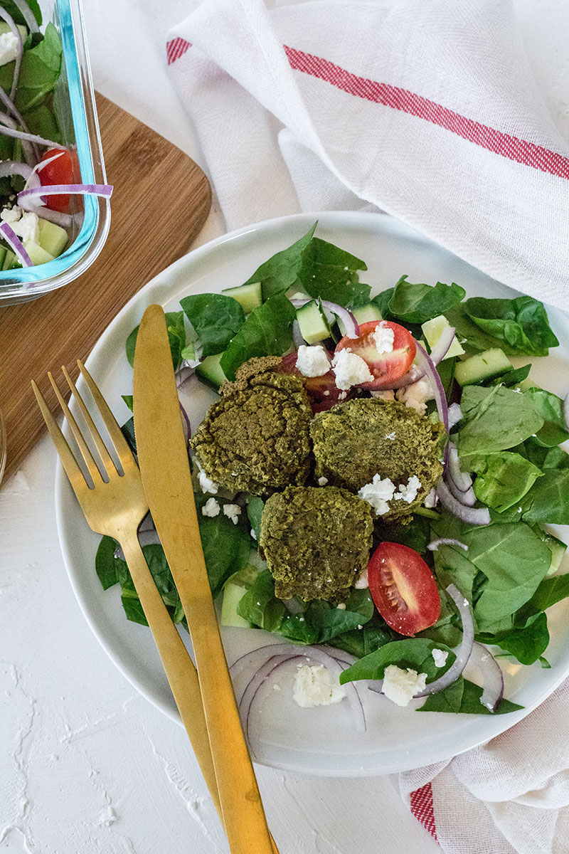 Baked Spinach Falafel is the perfect protein to turn to when you're looking for lighter, healthy dinners that are quick and easy to make. Make a big batch during meal prep and enjoy these falafel paired with a simple greek salad throughout the week.