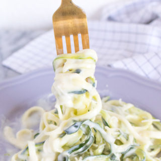 This simple 5-Ingredient Zucchini Noodle Alfredo is lightened up with low fat ingredients and spiralized zucchini noodles for a veggie-packed, one-pot dish that's ready in 15 minutes!