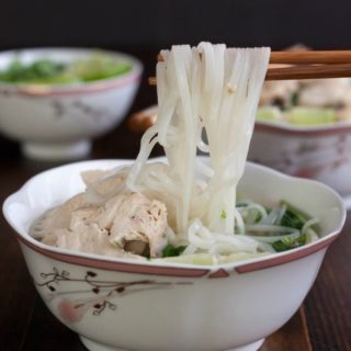 Love Pho? Learn how to make authentic Vietnamese Chicken Noodle Soup (Pho) at home. With just four ingredients, plus garnishes, and about two hours, you can enjoy this budget-friendly, healthy meal for dinner tonight!