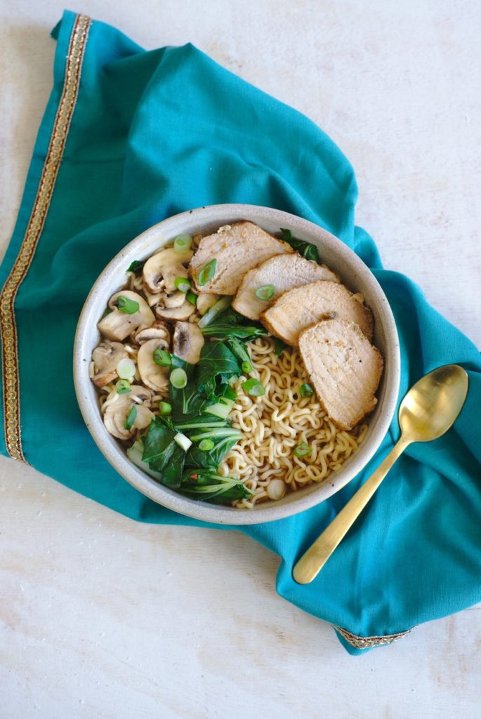 This 20-Minute Spicy Pork Ramen Bowl is the perfect weeknight meal. No one can resist these ramen noodles in a spicy chicken broth with sliced pork, mushroom, and bok choy.