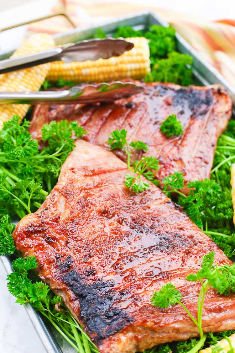 Outdoor entertaining just got more delicious with this 6-ingredient recipe for Sweet and Spicy Grilled Pork Ribs. A brown sugar, garlic, and cayenne pepper rub gives these ribs a flavorful glaze that's second to none!