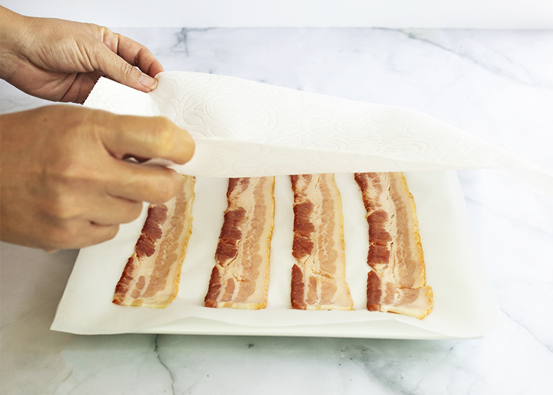 Love bacon, but hate the time and mess of making it? This handy kitchen hack is your saving grace. Enjoy your favorite protein source in all of your best recipes when you learn how to make 4-Minute Perfect Crispy Bacon with no mess!