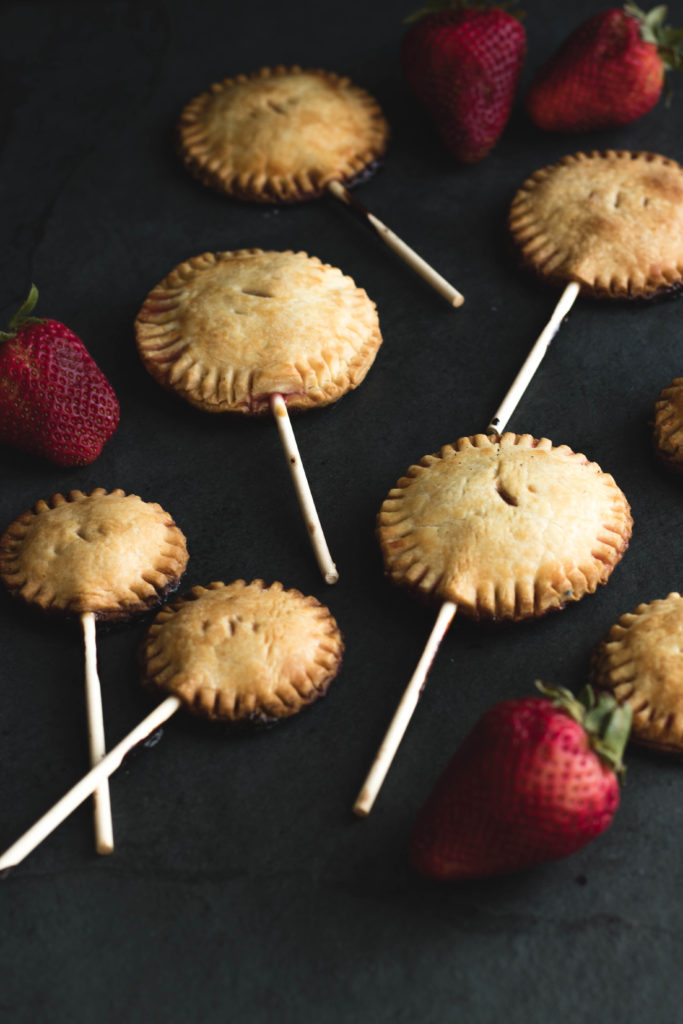 These Strawberry Pie Pops with Vanilla Glaze transform farmers market fruit into an American classic dessert on a stick. This hand-held, mini dessert is perfect for outdoor entertaining because there are no utensils required!