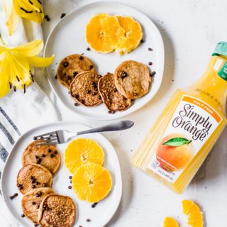 Fruity Chocolate Silver Dollar Pancakes are exactly what you need on your brunch menu. This gluten-free breakfast uses orange juice and bananas to get its fruity flavor. With just 15 minutes, you have the perfect easy breakfast that's fancy enough for any occasion, even Mother's Day!