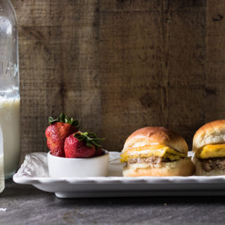 These 30-minute Cheesy Sausage Egg Breakfast Sliders are a great on-the-go breakfast or breakfast menu item for Sunday brunch. A satisfyingly simple, make-ahead breakfast that's sure to please!