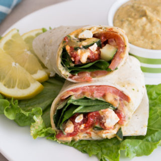 Why waste money at your favorite sandwich shop when you can make this Mediterranean-inspired Cilantro Jalapeño Hummus Wrap at home. This cheap healthy meal is a 10-minute lunch or dinner with fresh veggies and hummus.