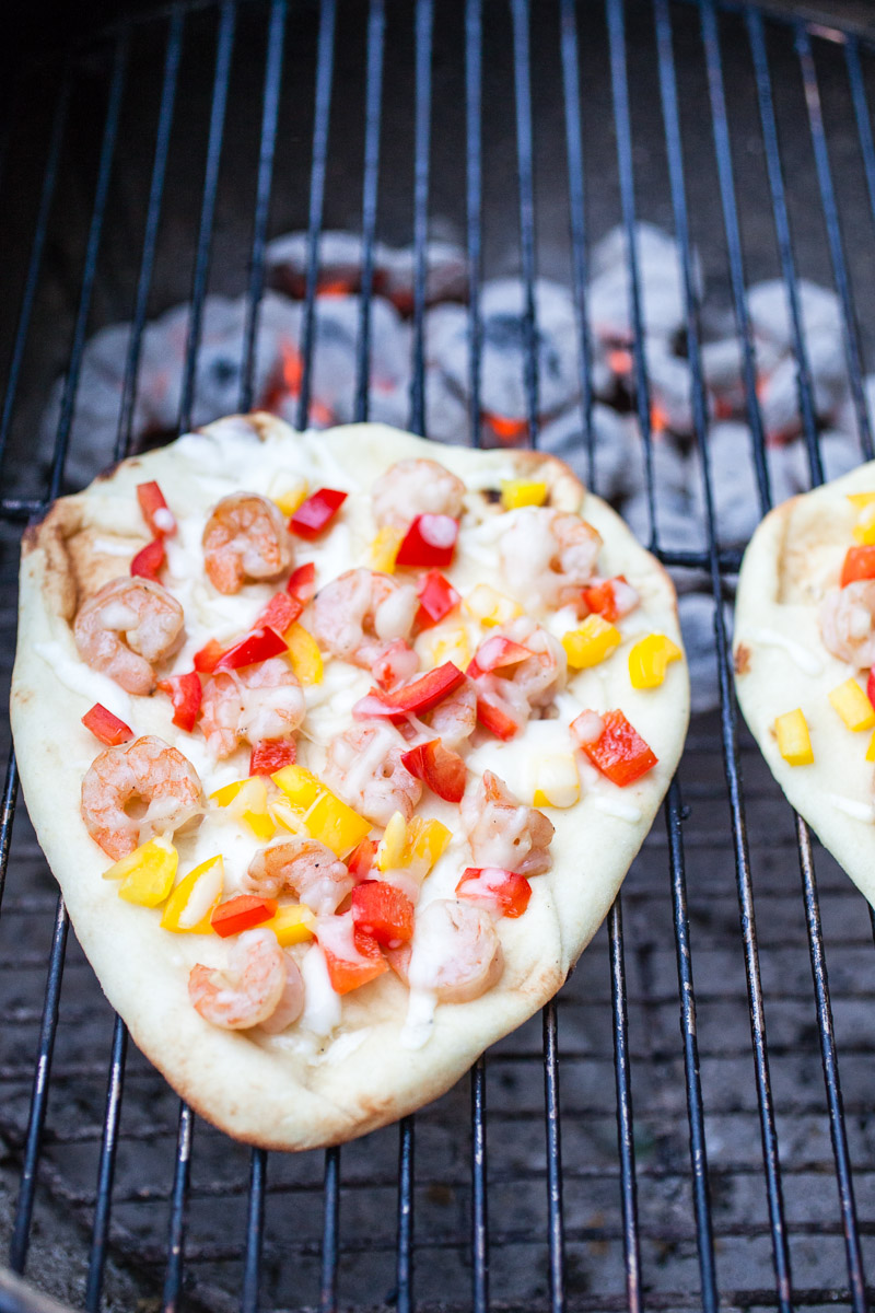 A farmers market delight, this Grilled Asian Shrimp Naan Pizza is a fresh 30-minute meal that doubles as a simple party appetizer. Take outdoor grilling to a new level of freshness with this simple recipe!