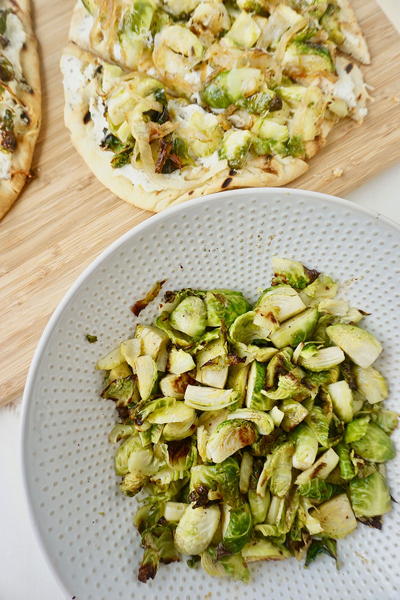 If you aren't enjoying some grilled pizza right now, are you even living? This Roasted Brussels Sprouts Grilled Pizza with Lemon Herb Ricotta is a farmers market delight that's ready in about 30 minutes.