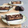 This No-Bake Chocolate Peanut Butter Tart is an easy dessert dream come true. A thick Oreo cookie crust, check! Cheesecake-like peanut butter filling, check! Silky smooth chocolate ganache topping, check! A simple no-bake dessert that only takes 20 minutes to prepare.