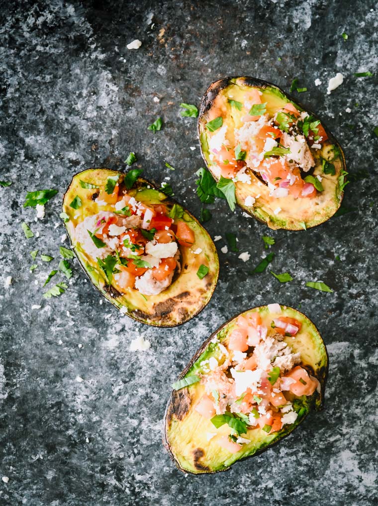 It's outdoor grilling season so why not change up your grilling routine with some southwestern grilled avocados? Stuffed with ground turkey and all of your favorite flavors of Mexican cuisine, these stuffed grilled avocados are the perfect light weeknight dinner or weekend lunch.