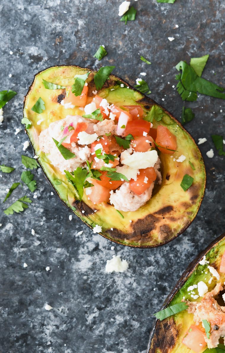 It's outdoor grilling season so why not change up your grilling routine with some southwestern grilled avocados? Stuffed with ground turkey and all of your favorite flavors of Mexican cuisine, these stuffed grilled avocados are the perfect light weeknight dinner or weekend lunch.