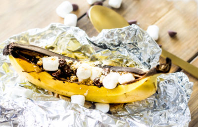 These Grilled Banana S'mores are a simple dessert perfect for outdoor entertaining. Just like the classic dessert, these s'mores use graham crackers, marshmallows, and chocolate, but even better because they're grilled right along side your burgers and corn directly in the peel!