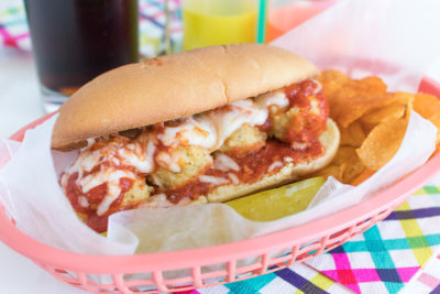 This slightly lightened-up Chicken Parmesan Meatball Sub sandwich is filled with homemade baked meatballs, marinara sauce, and melted cheese! A budget-friendly, deli-style meal you'll love that's ready in 30 minutes.