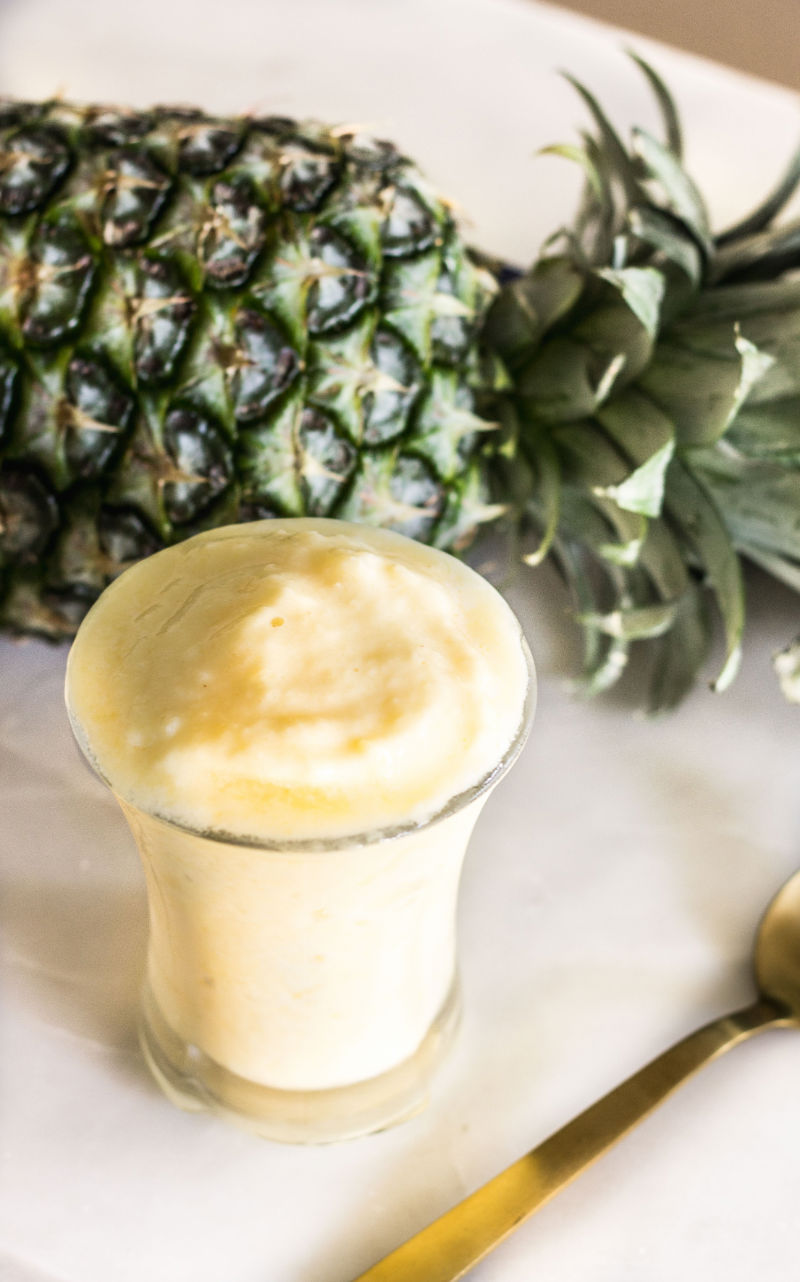 Have you ever had a Dole Whip before? Bring the magic of Disney to your outdoor entertaining space with this simple recipe for a Homemade Dole Whip. A 4-ingredient pineapple dessert everyone will love!