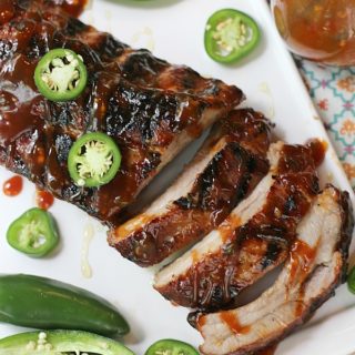 These Honey Jalapeño Grilled Pork Ribs are a sweet and spicy dinner combo that's perfect for a weeknight meal or outdoor entertaining. Tender and juicy ribs simple enough for a grilling novice to make.