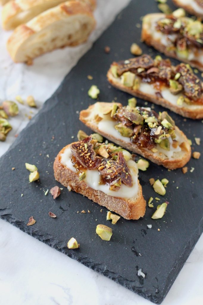 Baked Brie Crostini with Figs and Pistachios