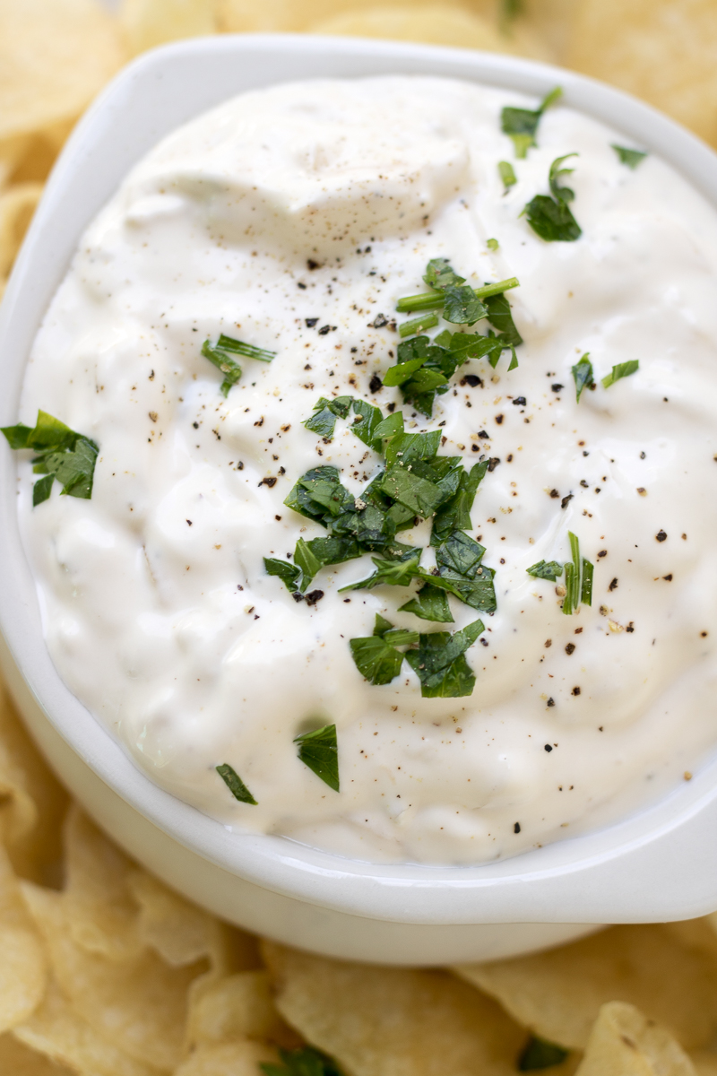 This Caramelized Onion Dip is an easy appetizer served with chips or veggies that's perfect for happy hour entertaining. The caramelized onions are made with a white wine reduction which makes this classic party dip the perfect white wine pairing!