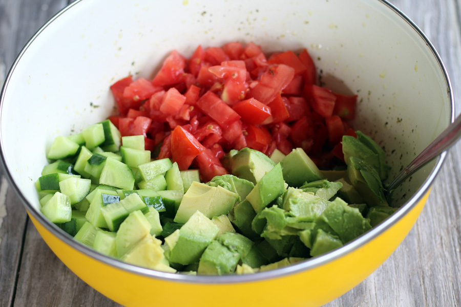 Cucumber Tomato Avocado Salad is a wonderful healthy side dish. This summer salad uses farmers market fresh cucumbers, ripe tomatoes, and creamy avocado for an easy side or light lunch everyone will love.