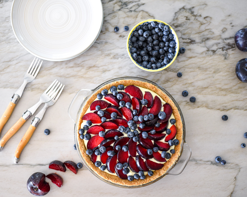 Who can resist this farmers market fresh Plum Blueberry Tart recipe? A no-bake dessert that takes very little hands-on prep time and delivers a sweet treat to impress party guests. An easy dessert recipe everyone will love no matter the occasion.
