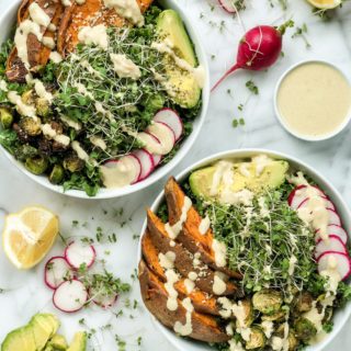 This Sweet Potato Kale Bowl is an upgraded kale salad that's perfect for a simple weeknight dinner. This 30-minute meal with roasted sweet potatoes, brussels sprouts, avocado, radish, micro greens, and tangy tahini dressing is the ultimate vegetarian dish.