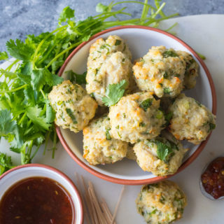 These Vietnamese-Style Chicken Meatballs are great for outdoor entertaining. Baked chicken meatballs made with fresh lemongrass and the flavors of Asia, when paired with a spicy dipping sauce, are the perfect party appetizer.