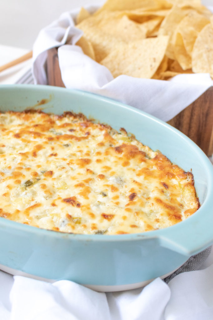 Whether you're outdoor entertaining, hosting happy hour at home, or celebrating a big event, this simple Cheesy Jalapeño Artichoke Dip is the appetizer you need on the party table!