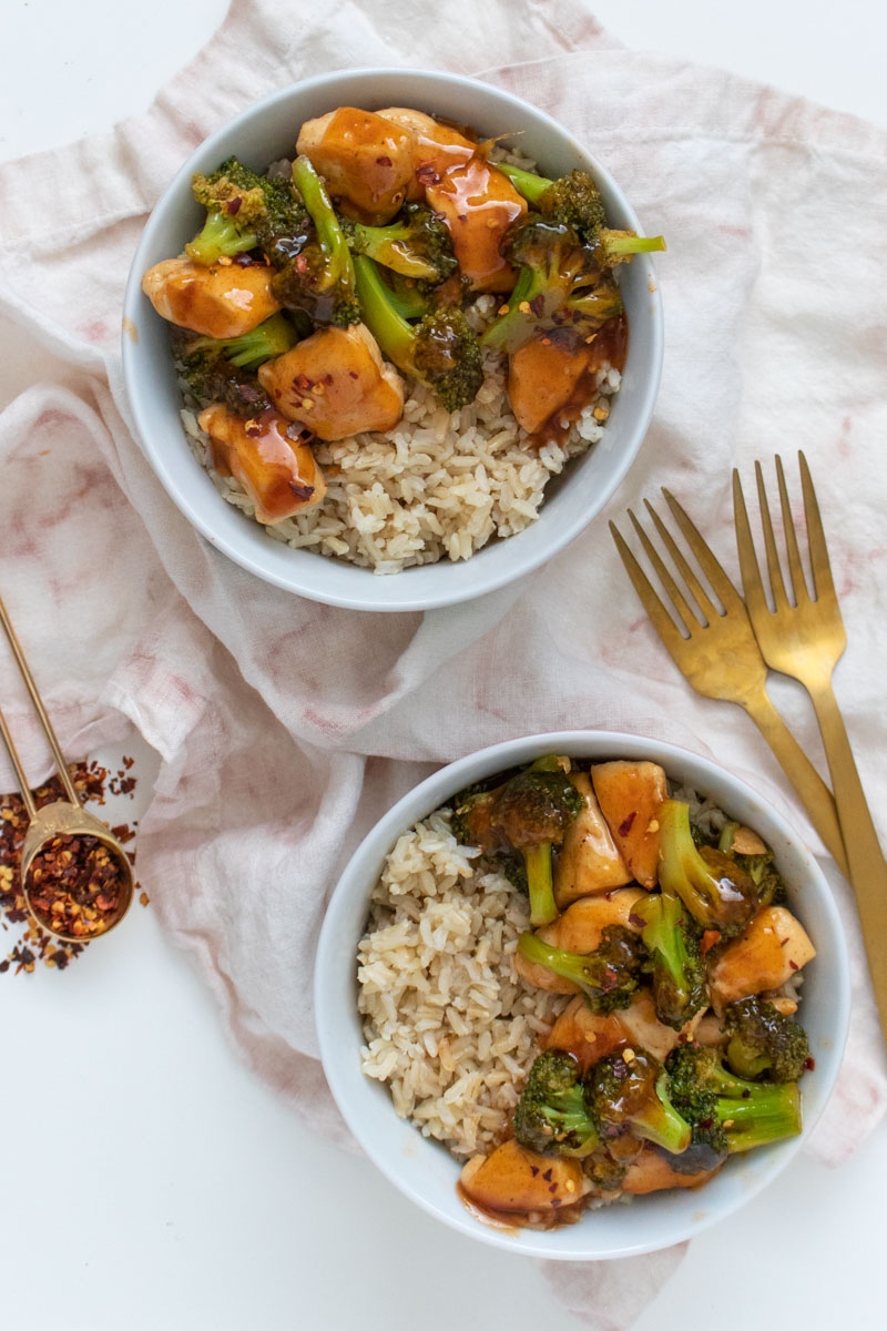 These takeout-inspired spicy Firecracker Chicken Bowls are a cheap healthy meal that's perfect for a date night dinner or weeknight meal. A budget-friendly, restaurant-quality, 30-minute meal.