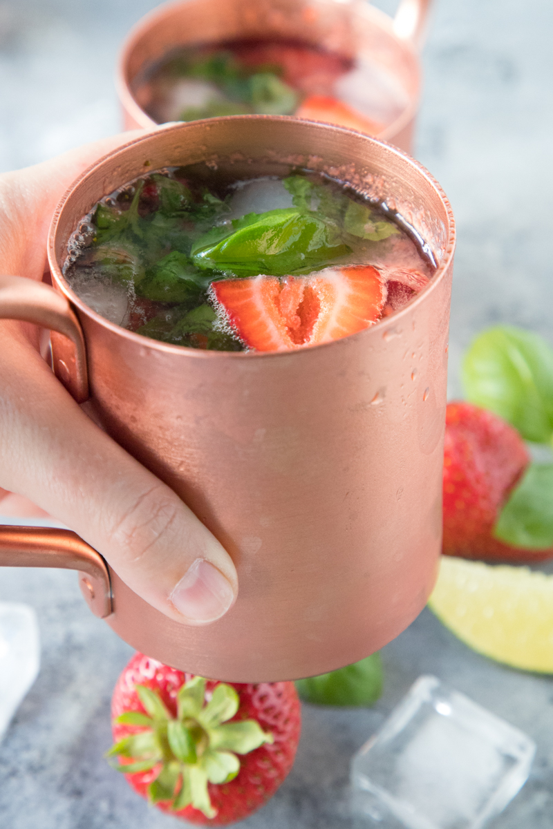 Head to your farmers market to pick up the fresh produce you need to make this 5-Ingredient Basil Strawberry Moscow Mule. Vodka, ginger beer, and fresh produce make the perfect summer cocktail, but you can enjoy it all year long!