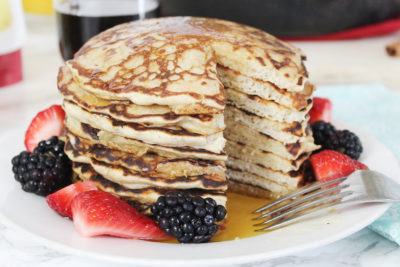 These Cinnamon Vanilla Spice Pancakes are a simple 6-ingredient breakfast that's fast enough for a busy workday, but fancy enough for Sunday brunch. Top them off with butter, syrup, and farmers market berries for the perfect quick breakfast!