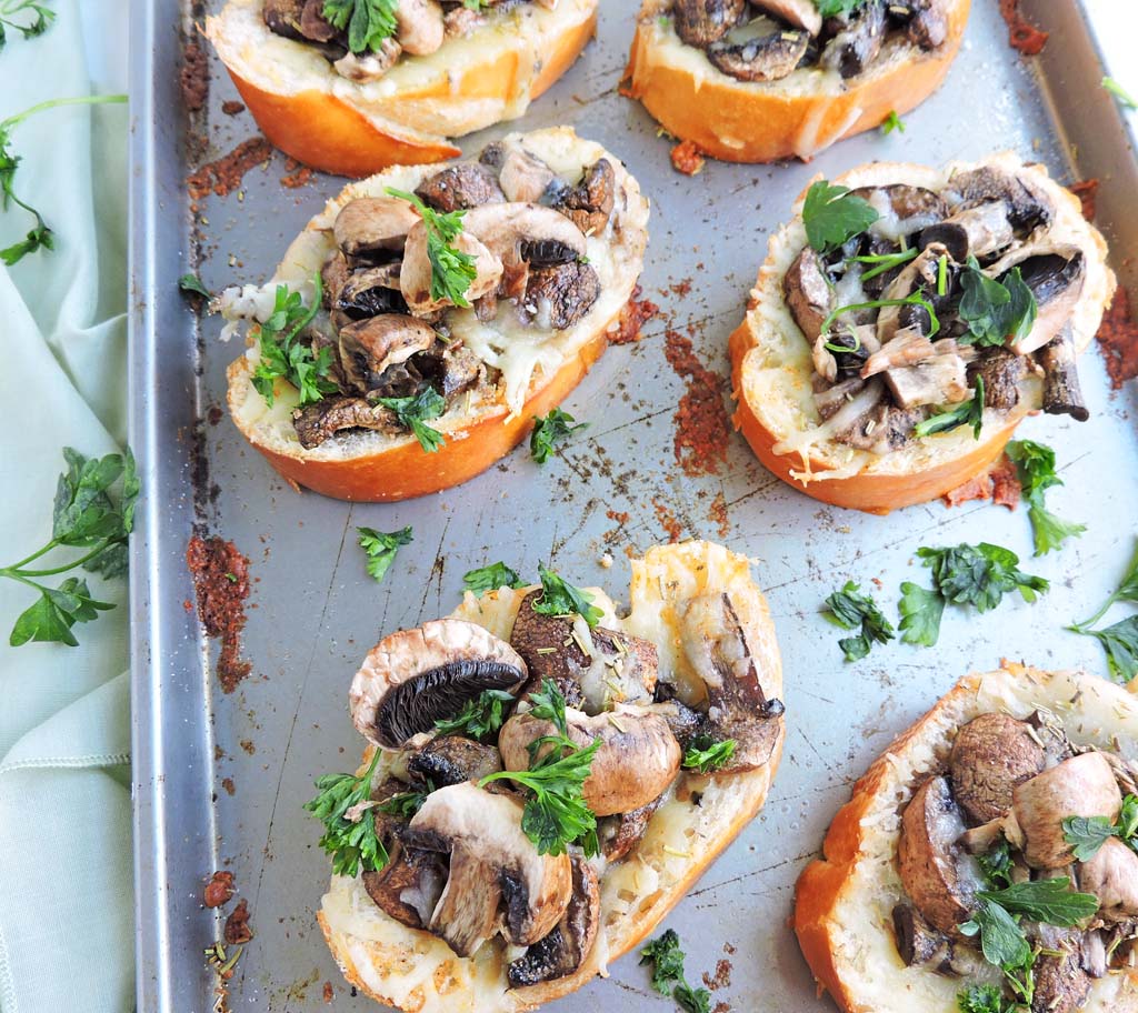If you're hosting happy hour at home or preparing a weeknight dinner and you're in search of an easy recipe, this Herb Mushroom Cheesy Garlic Bread recipe is for you! A 15-minute appetizer or side that's so simple, the kids can help.
