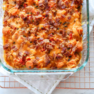This Sweet Potato Breakfast Casserole is loaded with sweet potatoes, eggs, cheese, bacon, and veggies. This make-ahead breakfast casserole is Paleo and Whole 30 compliant. Versatile and fancy enough for a Sunday brunch with friends!
