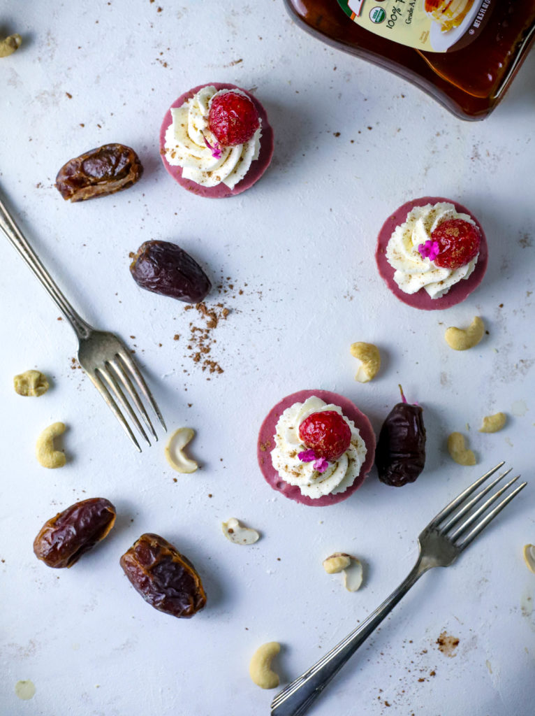 Impress party guests with these simple Vegan Raspberry Mini Cheesecakes. These small bites are a refined sugar-free, simple no-bake dessert. A little on the lighter side, everyone will love this decadent mini dessert!
