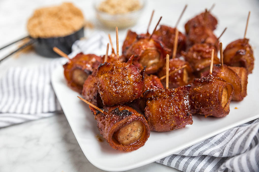 Introducing your new favorite tailgating party food...Bacon-Wrapped Chicken Sausage Bites! A savory-sweet 5-ingredient appetizer with bold flavors. This small bites, easy appetizer will be the talk of the party!