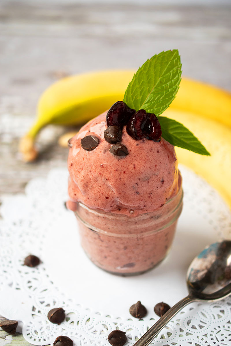 This 3-ingredient Cherry Chocolate Nice Cream is a dairy-free dessert that's ready in five minutes! Get all of the indulgence of ice cream in this healthier dessert made almost completely with fruit making it a great after-school snack.