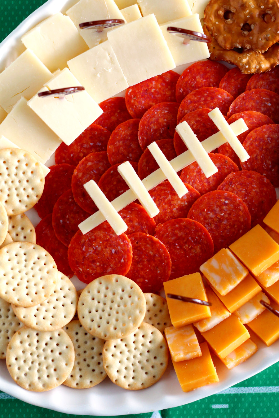 Affordable entertaining during football season isn't that hard when you bust out this Football Charcuterie Platter! This simple tailgating appetizer is sure to score a touchdown with party guests.