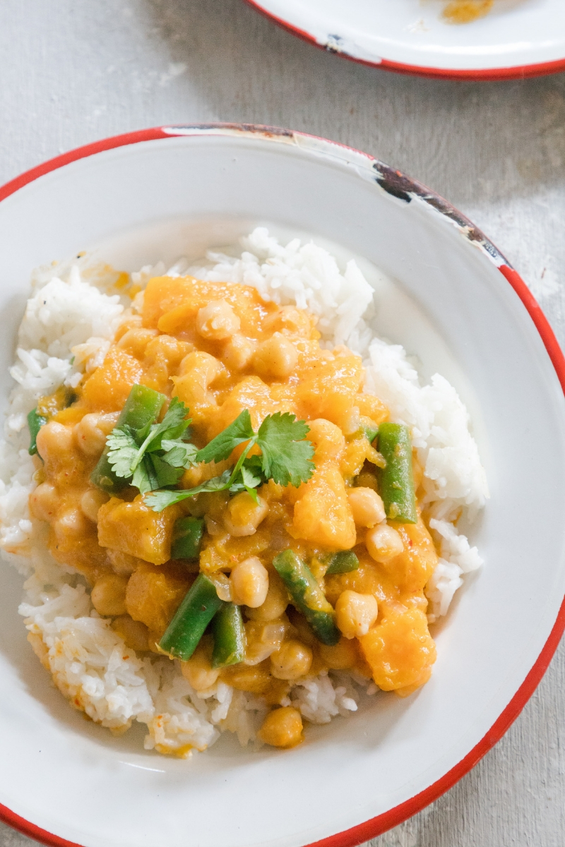 Perfect for those looking for more plant-based meals in their diet, this Pumpkin Chickpea Curry is a cheap healthy meal you'll love! This easy-to-make vegetarian dish is pure comfort food on a plate.