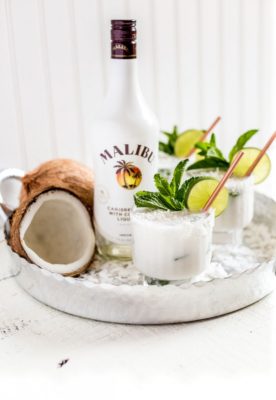 This Coconut Mojito MALIBU® Rum Cocktail is the ultimate happy hour drink for entertaining guests. A tropical twist on a classic cocktail, this recipe uses fresh lime juice, granulated sugar, fresh mint leaves, crushed ice, Malibu, coconut cream, and club soda.