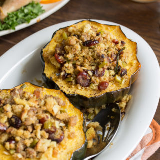 If you're cooking for two this holiday season, this Sausage Stuffing Acorn Squash needs to be on your holiday menu. Fresh produce, pork sausage, and cranberries dress up store-bought stuffing in this single-serve side dish.