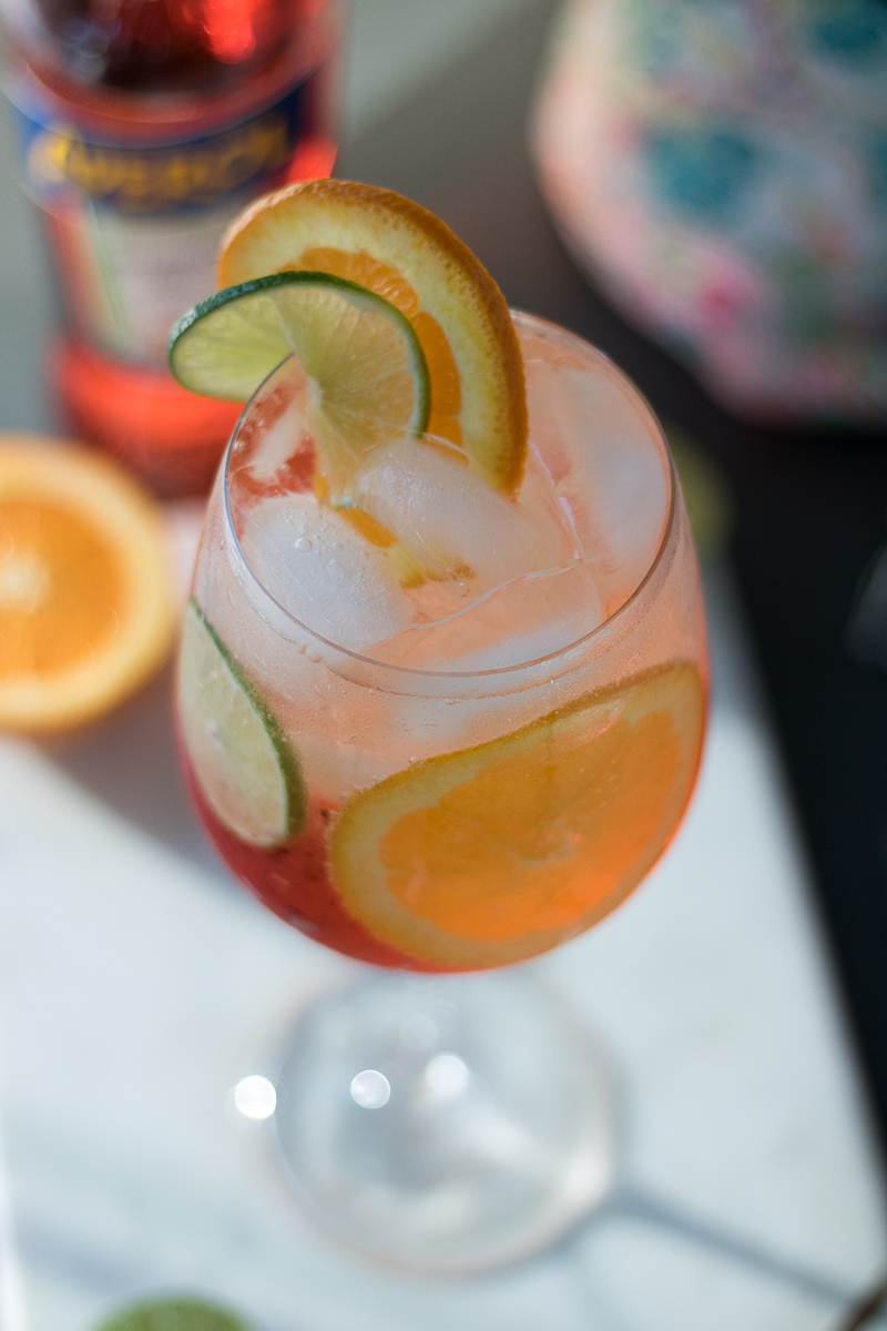 The Aperol Spritz is making a comeback for a reason! This Italian classic cocktail consists of Aperol, Prosecco, orange and lime slices, and club soda. Perfect for dinner parties or happy hour, the vibrant color and flavors add to the joy of any occasion!