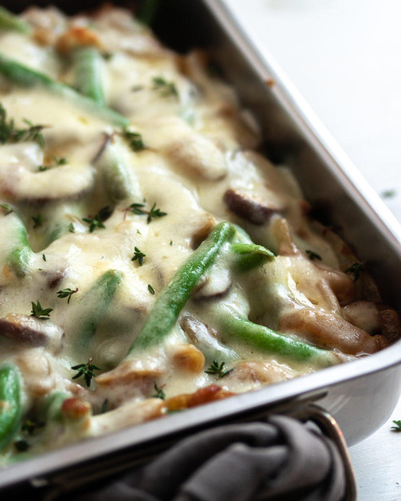 These Cheesy French Onion Green Beans are a flavorful twist on the classic green bean casserole. Whether you're entertaining for Friendsgiving, attending a family gathering, or bringing something to your office potluck, this is the portable side dish you need to bring!