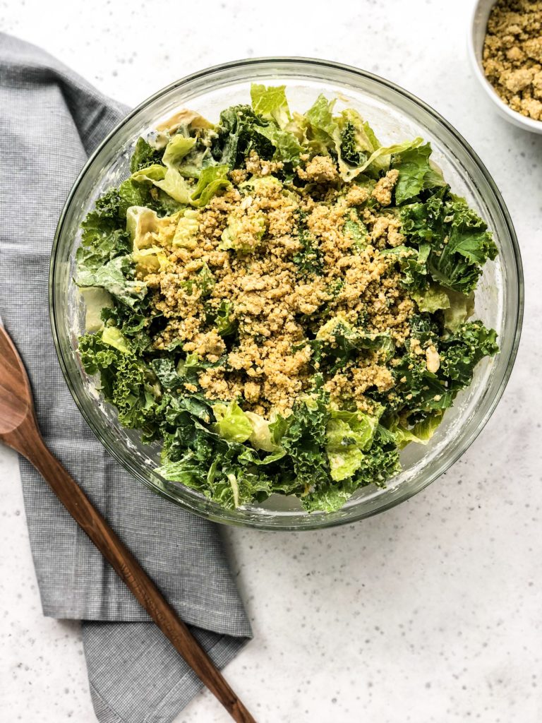 This Vegan Caesar Salad is a crowd-pleasing, deli-style salad. The dairy-free Caesar dressing is creamy, zesty, garlicy, and absolutely delicious thanks to the healthy substitution of tahini instead of mayo. This healthy side dish is just as good as the traditional Caesar salad.