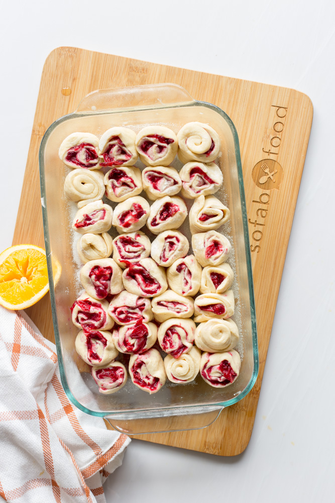 Enjoy these super simple Orange Cranberry Mini Sweet Rolls as dessert on your holiday menu, then eat leftovers for breakfast. Full of fall flavors, this mini dessert uses store-bought crescent dough to create small bites for two!