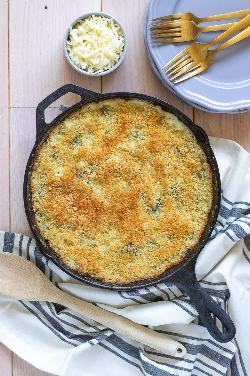This homestyle Baked Spinach Mac N Cheese is a healthier twist on a classic side dish. Perfect for office potlucks and holiday entertaining, this portable side dish is as simple as it is delicious!