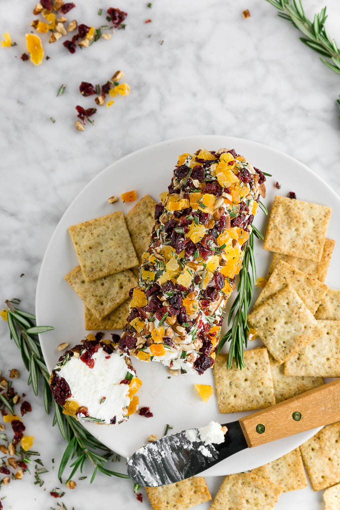 If you're entertaining for the holidays and you're looking for a make-ahead appetizer that's simple yet stunning, this Nutty Cranberry Goat Cheese Log is the easy appetizer for you. Goat cheese, dried cranberries, apricots, nuts, and honey are the road to the perfect party appetizer!