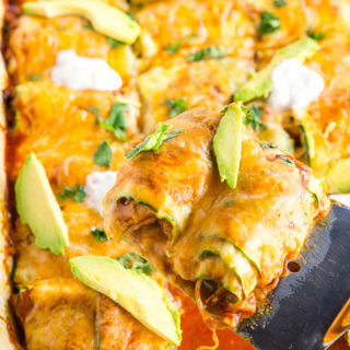 If you're on a gluten-free diet (or even if you're not!), you'll love this lightened up version of classic chicken enchiladas! These Low-Carb Zucchini Chicken Enchiladas use veggie noodles instead of tortillas. This healthier classic is a budget-friendly meal perfect for a weeknight dinner!