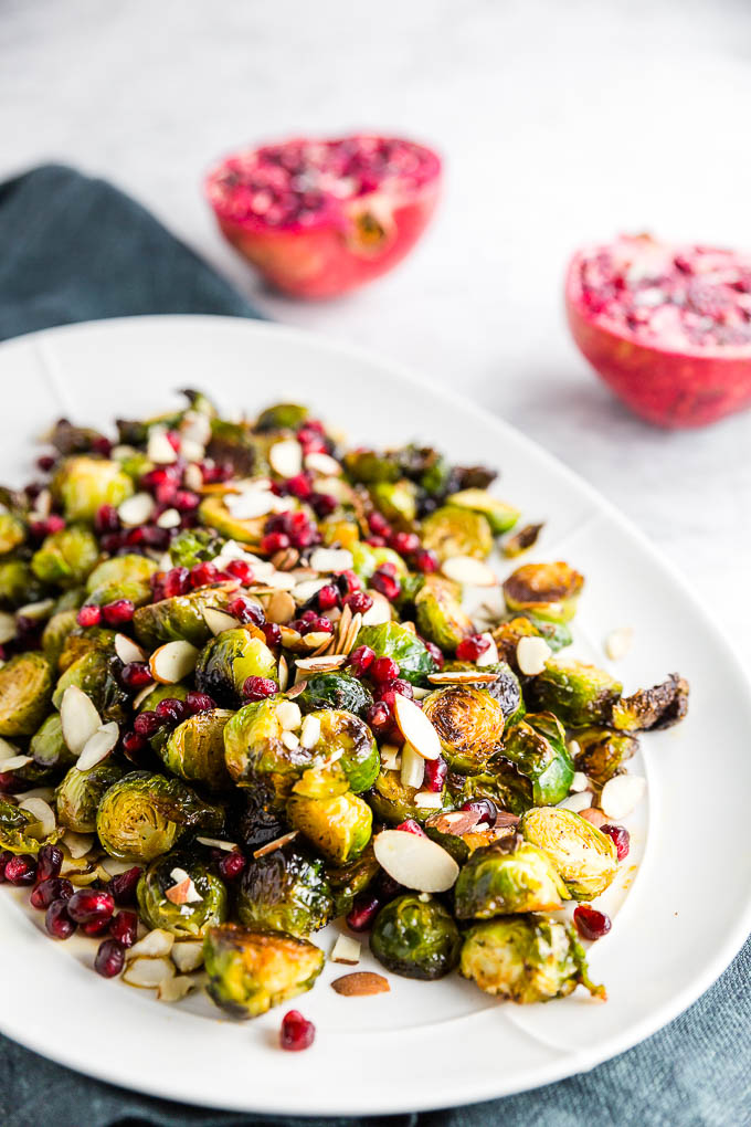 Looking for a 30-minute side dish easy enough for a weeknight meal, yet fancy enough for entertaining guests? This Pomegranate Roasted Brussels Sprouts recipe is the seasonal side dish you need! Sweet and tart, this simple side dish will enhance any meal!